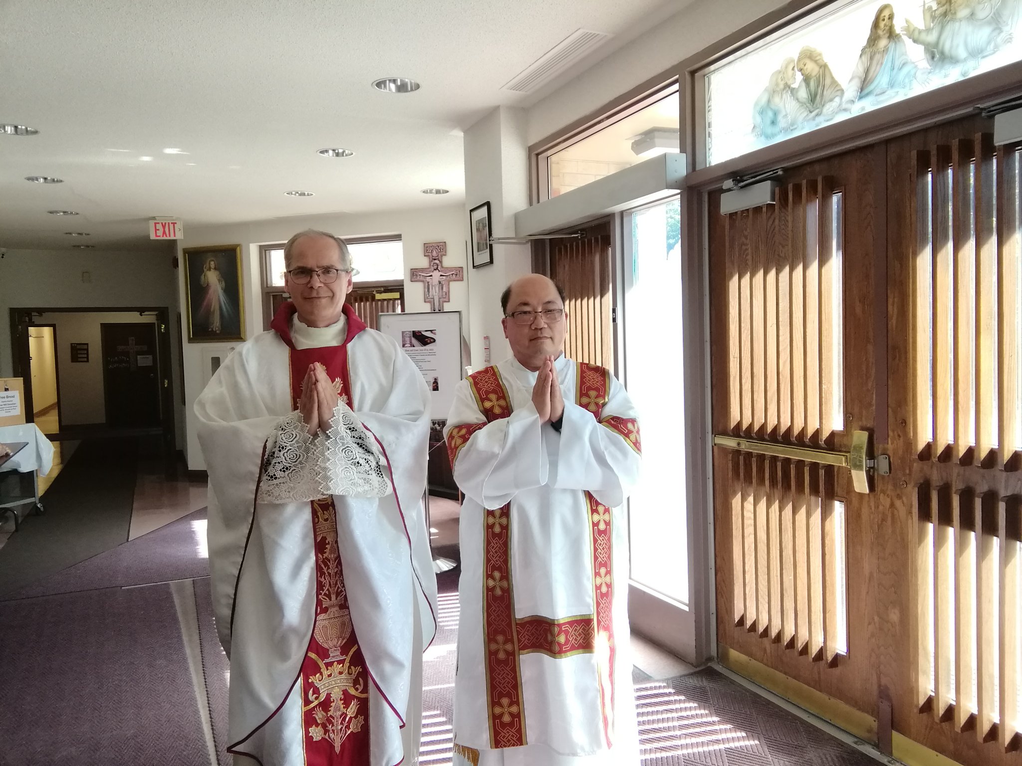 meet and greet photo of father and deacon peter